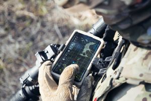 Soldier viewing portable electronic device